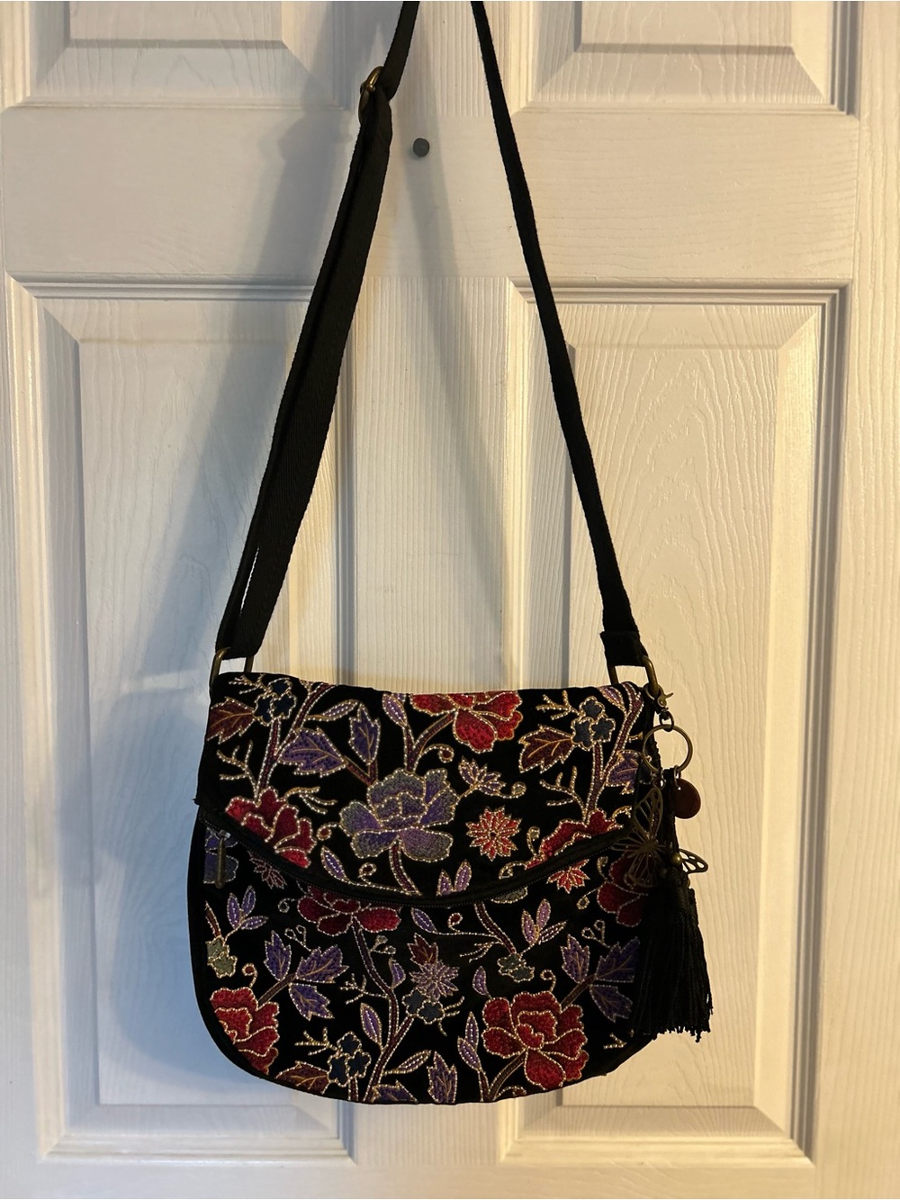 SakRoots Black Floral Embroidered Crossbody Bag with Tassel
